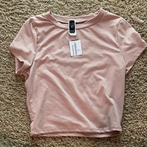 Pink shirt, never worn, soft material,size small